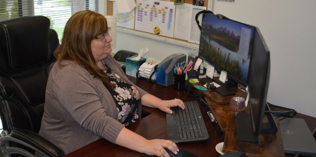 Jen Consoli working at her desk.